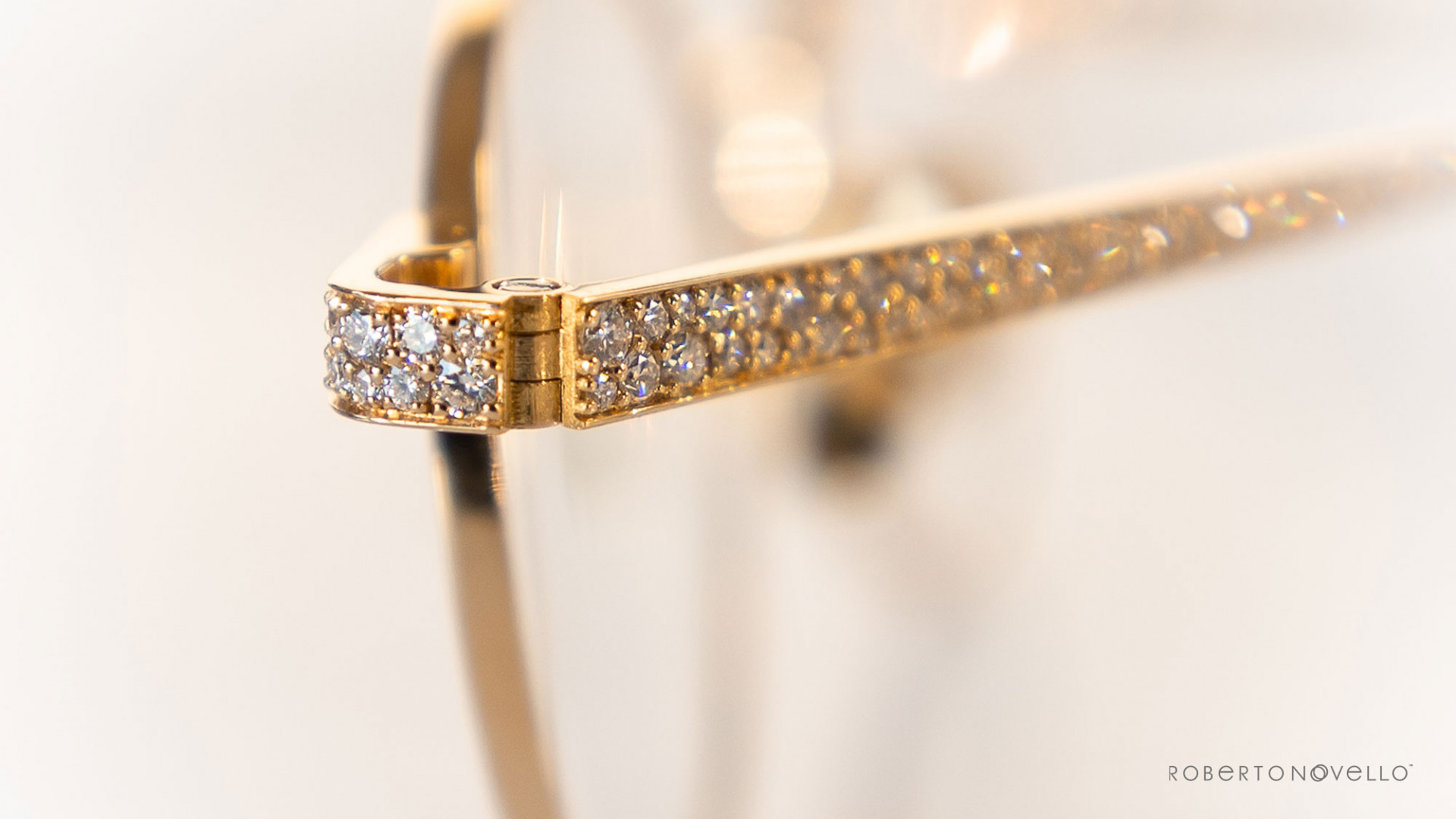 precious stones details on golden glasses
