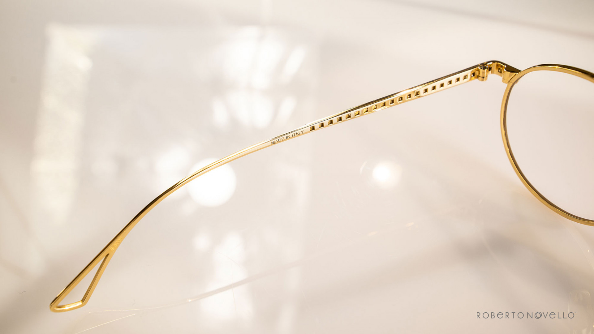 details of golden glasses frame
