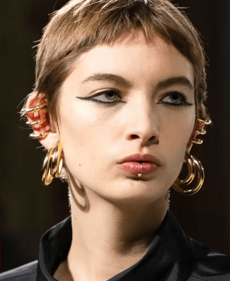valentino fashion show model closeup punk earrings
