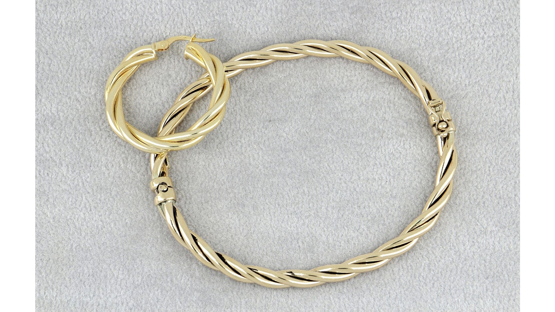 set of gold bracelet and earring