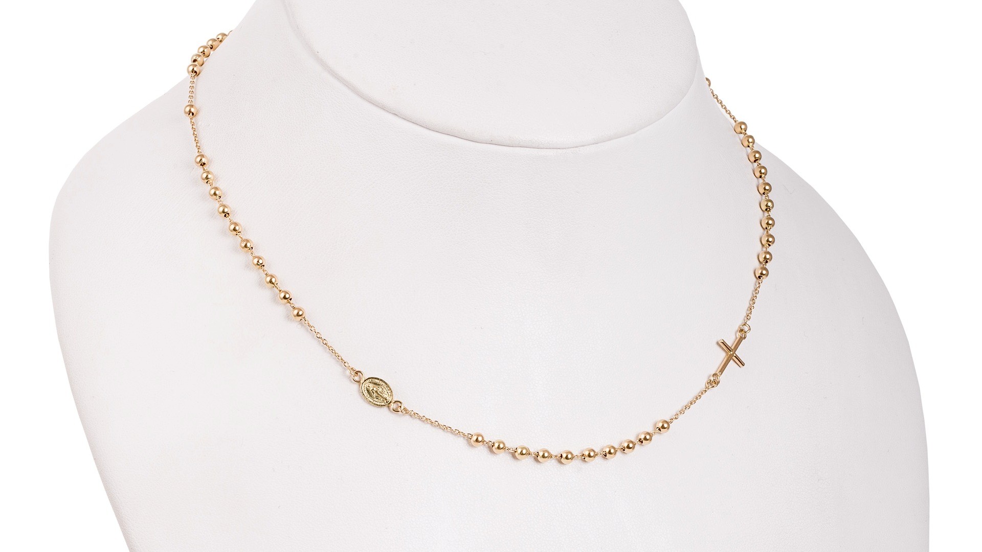 gold necklace with church-inspired details