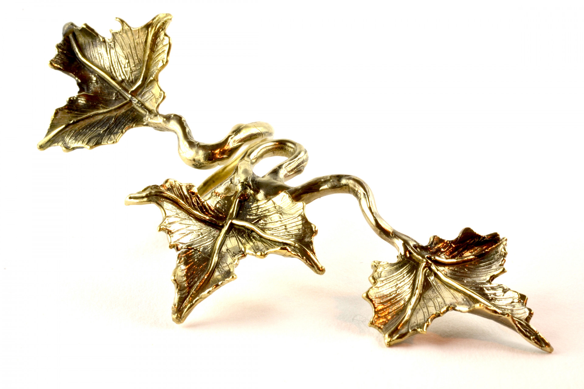 gold jewel with leaves