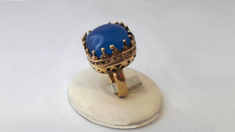 gold ring with blue stone
