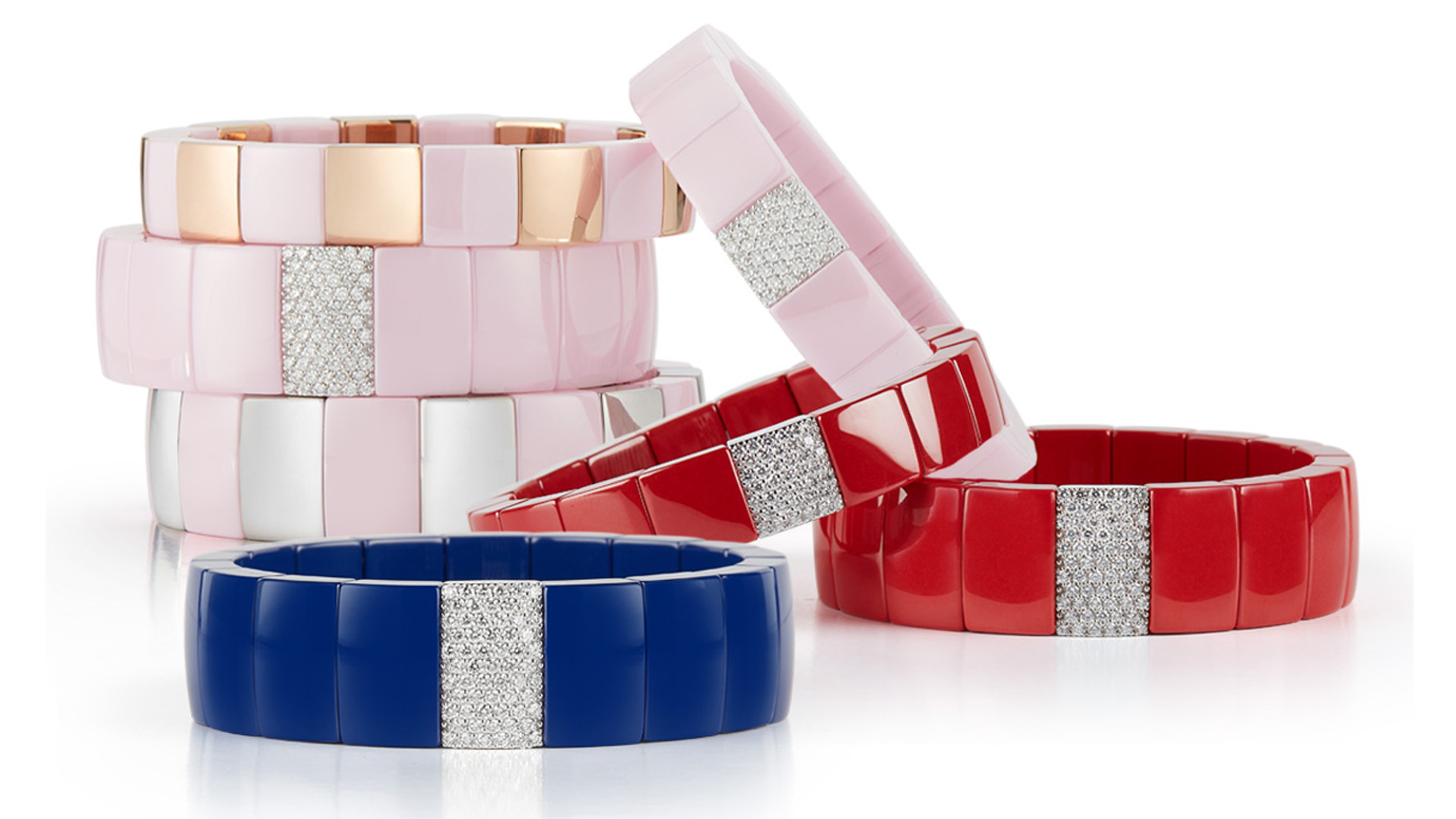 set of pink, red and blue bracelets with precious stones